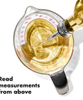 Angled 2 Cup Measuring Cup With Easy Read From Above Measurements, BPA Free Tritan Renew, pouring liquid, top view