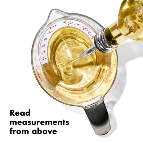 Angled 2 Cup Measuring Cup With Easy Read From Above Measurements, BPA Free Tritan Renew, pouring liquid, top view