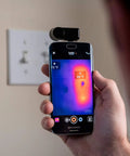 Compact All Purpose Thermal Imaging Camera For Android USB C Turns Your Phone Into A Real World Thermal Cam For Home Jobsite And More Spot Energy Loss Electrical And Mechanical Faults Water Damage And Hidden Issues shown attached to a phone.