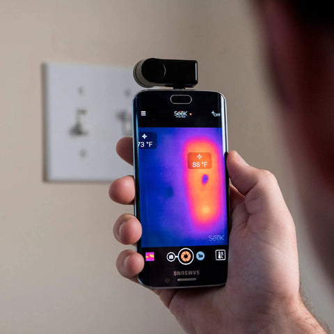 Compact All Purpose Thermal Imaging Camera For Android USB C Turns Your Phone Into A Real World Thermal Cam For Home Jobsite And More Spot Energy Loss Electrical And Mechanical Faults Water Damage And Hidden Issues shown attached to a phone.