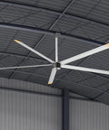 Industrial 144 Inch Aluminum Ceiling Fan Equipped With An Ultra Quiet Dc Motor And Five Heavy Duty Blades Delivering Kickin Airflow For Warehouses And Spacious Rooms In Sleek Silver Gray Finish, viewed from below in a spacious setting.