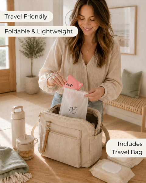 Woman unpacking a pink pouch from a foldable travel potty seat bag for toddlers featuring no pinch silicone grip.