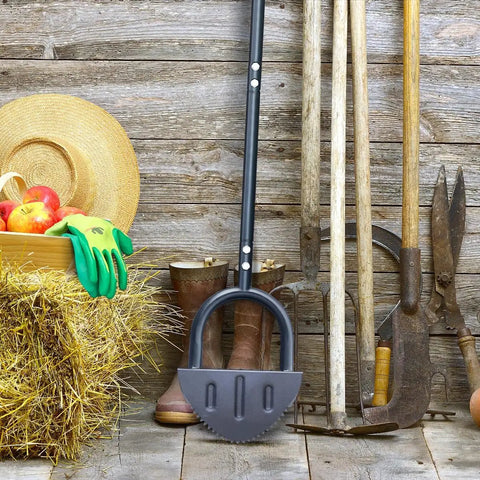 Saw Tooth Lawn Edger With T Grip Handle For Long Reach 38 Inch Half Moon Edging Tool leaning against rustic wall