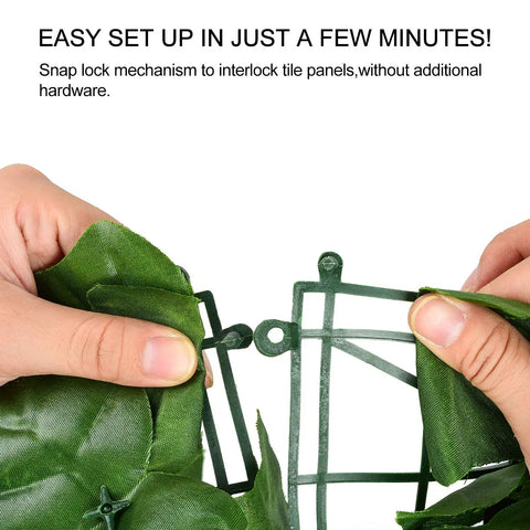 Close-up of hands assembling Artificial Ivy Privacy Fence Screen 118 By 39.4 Inches with snap lock mechanism, faux ivy leaves