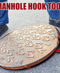 Heavy Duty Manhole Cover Hook 36 Inch With Five Eighth Inch Hex Alloy Steel Lifter lifting a manhole cover