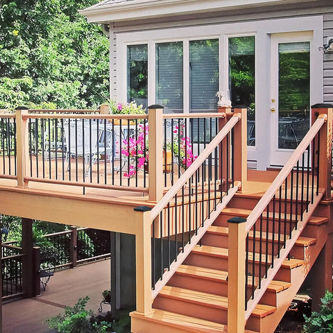 Top Shelf Black Metal 4X4 Post Caps For Deck Railings And Wooden Fences, fitted on deck railing with stairs.