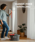 Heavy Hitter Microfiber Spin Mop And Bucket Set Including Three Extra Washable Replacement Pads For Fast Dirt Trapping And No Sweat Floor Mopping Quick Dry Finish On Hardwood with woman using hands-free wringing.