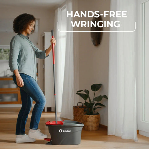 Heavy Hitter Microfiber Spin Mop And Bucket Set Including Three Extra Washable Replacement Pads For Fast Dirt Trapping And No Sweat Floor Mopping Quick Dry Finish On Hardwood with woman using hands-free wringing.