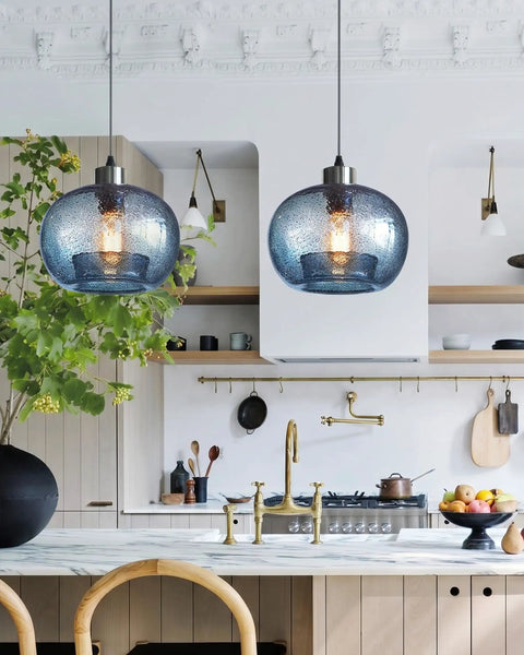 Stylish Hand Blown Glass Pendant Lights For Kitchen Island In Blue Marble Finish Modern Rustic Farmhouse Style With Brushed Nickel Hardware 8.7 Inch Diameter 2 Pack hanging over a kitchen island