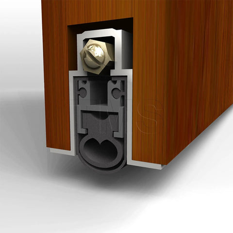 Close-up of Heavy Duty Under Door Seal with Double Neoprene Bulb Seal Keeps Drafts Out 1 Inch Drop inside wooden door, aluminum casing.