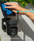 Person cleaning Power Up Your Outdoor Security Cams With This Ultra Efficient 5V Solar Panel 23 Percent Energy Conversion 9.8 Foot Cable USB C And Micro USB Compatible Weather Resistant 360 Degree Adjustable Bracket Works With Tapo Eufy Aosu And More mounted next to camera
