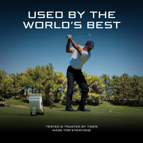 Golfer using Portable Golf Launch Monitor And Simulator With 5D AI Radar, 4K Camera And OLED Display on outdoor range.