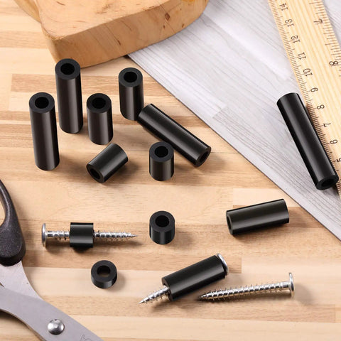 Outlet Spacer Kit With 120 Non-Threaded 6mm Rubber Spacers, assorted sizes on a table with screws and ruler, black