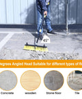 18 Inch Push Broom With 63 Inch Four Section Handle for Outdoor Cleaning, shown on concrete with 45-degree angle ergonomic grip.