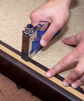 Professional Grade Upholstery Tack Strip Half Inch Wide By Seventy Yards Long Delivers Dead Nuts Straight Edges Hides Staples Quick On Couches Chairs And Recliners No Sweat being stapled onto a leather surface.