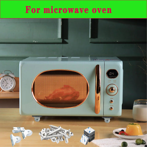 Microwave oven, mint-green retro with copper trim and front control panel; screws and hardware on the table.