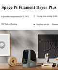 3D Printer Filament Dryer And Storage Box With 360 Degree Hot Air Circulation 80W PTC Heater on desk next to filament spools