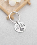 Trust Me I Am An Engineer Keychain With Gear Design on a wooden tray