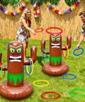 Inflatable Luau Tiki Pool Ring Toss Set With 4 Rings And Tiki Base 25 Inch Tiki Toss Beach Party Toy For Adults in use outdoors