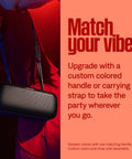 Person holding SoundLink Max Bluetooth Speaker Portable Party Ready With Deep Bass And Big Sound IP67 Waterproof Rope Handle