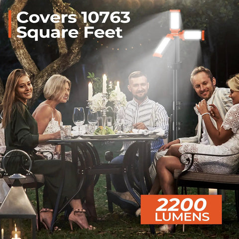 Rechargeable 12000mAh Camping Light With Adjustable Stand And 3 LED Heads illuminating an outdoor dinner scene at night.