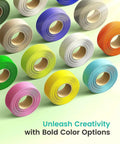 Multiple rolls of colorful filament for 3D printing, including green, yellow, and blue, displayed on a pastel background.
