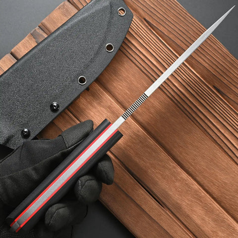 Close-up of the Rugged AUS 10 Fixed Blade Knife with Carbon Fiber Handle showing full tang blade and sheath on wood surface.