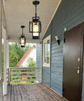 Top Shelf Modern Black Metal Motion Sensor Outdoor Pendant Light Slick Finish Exterior Hanging Lantern in porch setting.