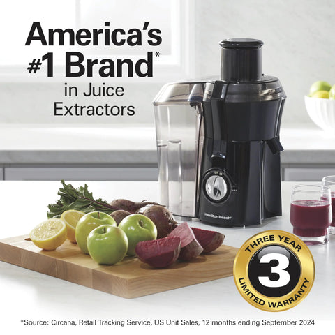 Hamilton Beach juicer machine in black with 3-inch feed chute and large pulp container on a kitchen counter.