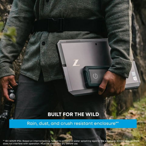 Person carrying G Drive ArmorATD 5TB Rugged Portable External Hard Drive USB C 5Gbps USB 3.2 Gen 1 Built To Last outdoors