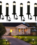 6-pack 12V LED Landscape Pathway Lights illuminating a driveway, bollard style, IP67 waterproof, warm white, outdoor garden lamps