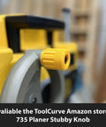 Front view of 735 Planer Stubby Knob on yellow planer machine, highlighting quick friction fit secure connection.