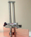 Uni Bender 2204 Heavy Duty Metal Bending Tool For 90 Degree Angles with adjustable height, shown bending copper sheet.