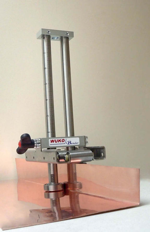 Uni Bender 2204 Heavy Duty Metal Bending Tool For 90 Degree Angles with adjustable height, shown bending copper sheet.