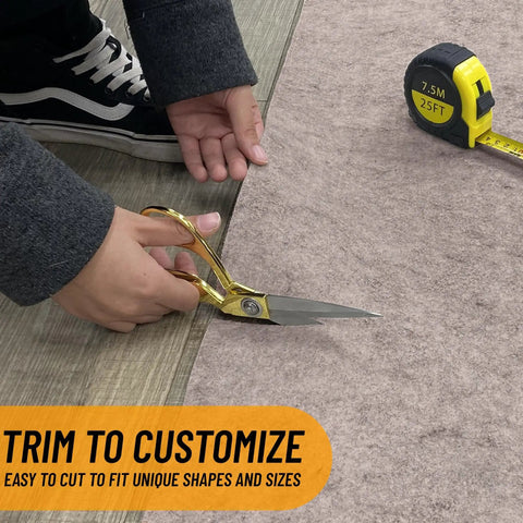 Person trimming 3 Ft By 11 Ft Rug Pad With Dual Surface Felt And Rubber Grip That Grabs Rugs In Place Quarter Inch Thick Non Slip.