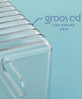 Close-up of grooved handle on Six Pack Clear Plastic Organizer Bins With Handles For Home Organization Kitchen Pantry Fridge Freezer Cabinets.