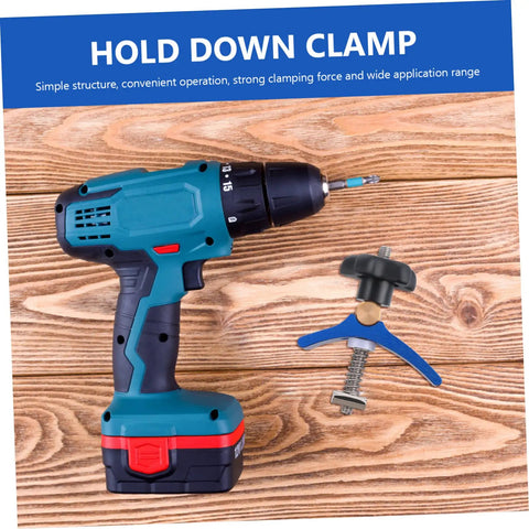 Blue and black drill next to Woodworking T Track Hold Down Clamp With Quick Act Pressure Plate for jigs and fixtures on wood surface.