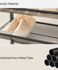 Heavy Duty Metal Shoe Rack Keeps Fifty Pairs Of Kicks Neat Eight Tier Entryway Closet Organizer With Removable Boot Shelf And Matte Black Finish To Slash Floor Clutter And Make Your Space Way Cozier with shoes on mesh shelves.