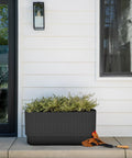 Long Planter For Porch Patio And Backyard In Durable Plastic Stone Composite Fluted All Weather Outdoor Pot For Shrubs And Flowers Modern Decor With Scratch And UV Resistant Finish on a porch