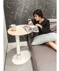 Adjustable Height Rolling Laptop Stand With Spacious Work Surface Smooth Caster Wheels Portable Computer Desk For Bedroom Living Room And Home Office Kick Back Ready Workstation by the couch with a magazine and coffee.