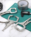 Heavy Duty Locking C Clamp Set Ten Pieces Six Inch Vise Grip Welding Clamps on cutting mat with tools