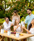 Snag This Solid Bulk Set Of Thirty 12 Ounce Double Wall Insulated Stainless Steel Tumblers With Lids And Straws Plus Cleaning Brushes For Weddings Parties And Favors, group enjoying drinks outdoors.