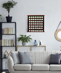 Mahogany Golf Ball Display Cabinet With Green Felt Backing And Brass Golfer Emblem wall mounted in an elegant living room setting