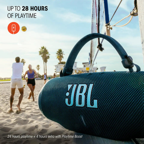 Charge 6 Portable Waterproof Bluetooth Speaker With AI Sound Boost hanging on a net with beach scene in background.