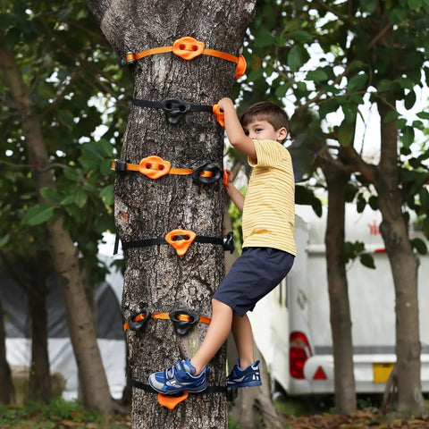 Child climbing on tree using 20 Ninja Tree Climbing Holds Kit With 6 Ratchet Straps For Outdoor Ninja Warrior Obstacle Course Training In Bright Orange And Black For Kid Safe Totally Fun Climbing Set.