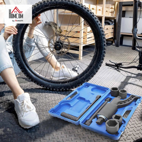 Heavy Duty Torque Multiplier Wrench Set With Carrying Case Go To Lug Nut Remover Kit For Cars SUVs Trucks And Heavy Duty Vehicles Includes 21mm 33mm 38mm And 41mm Sockets in open blue case beside bicycle wheel