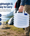 Person carrying collapsible water container with spigot for camping and road trips, lightweight plastic dispenser.