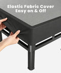 King Size Box Spring And All In One Mattress Foundation 18 Inch Steel Frame hands adjusting elastic fabric cover