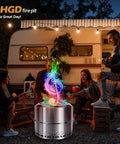 Lit Color Changing Campfire Packets Rainbow Flames For Fire Pit with friends around a fire pit by a camper trailer at night.