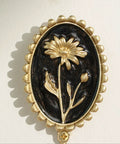 Super Clean Set Of Three Straight Up Vintage Wall Hooks With French Garden Floral Details and classic scalloped metallic hardware close-up